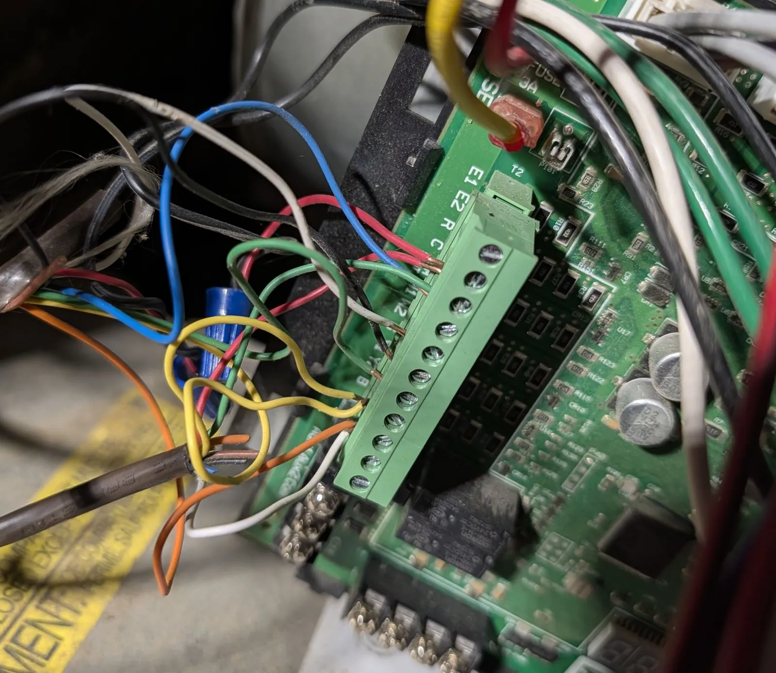 Low-voltage thermostat wiring landed on a furnace control board during a Bakersfield diagnostic
